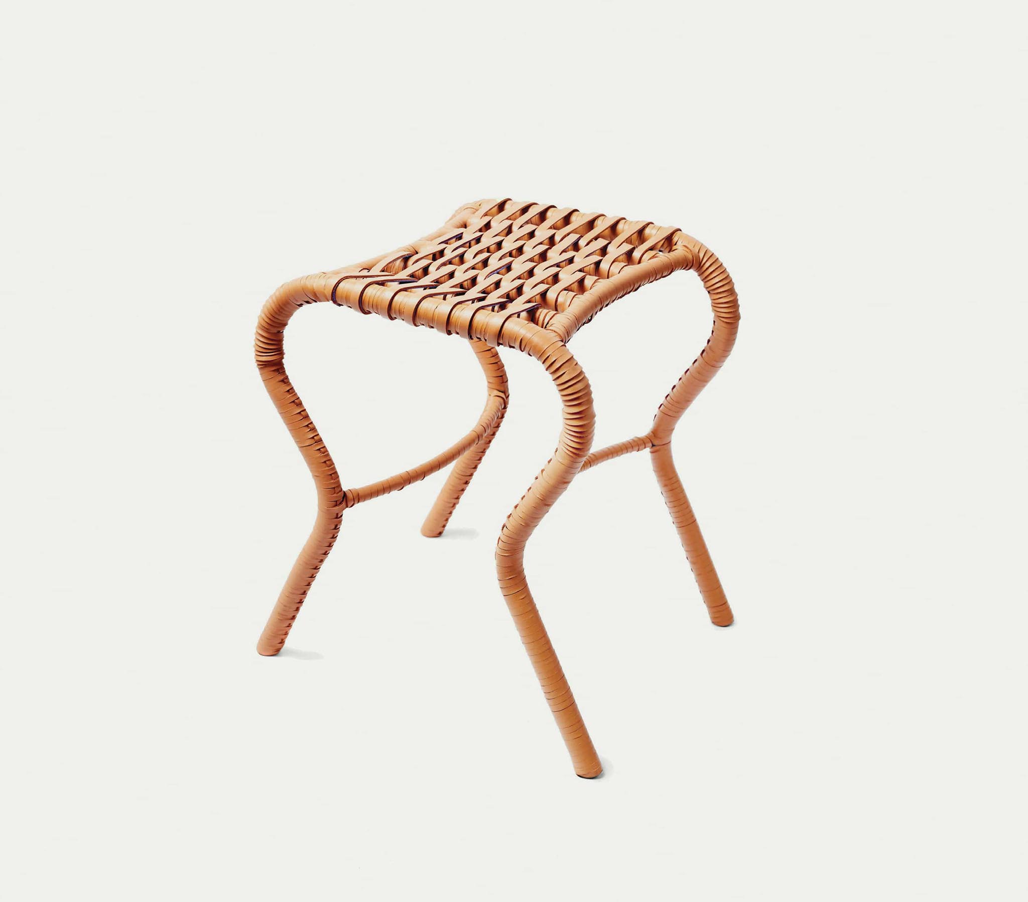 sculptural woven leather bata stool by Lani Adeoye