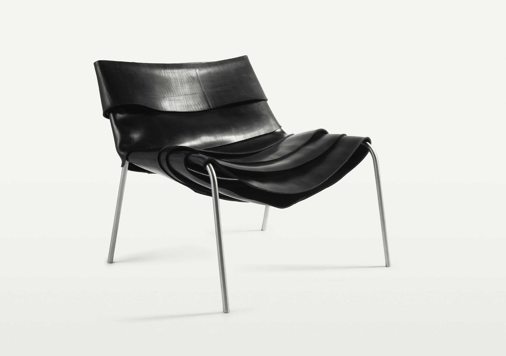 contemporary black leather chair with metal frame by Carol Gay