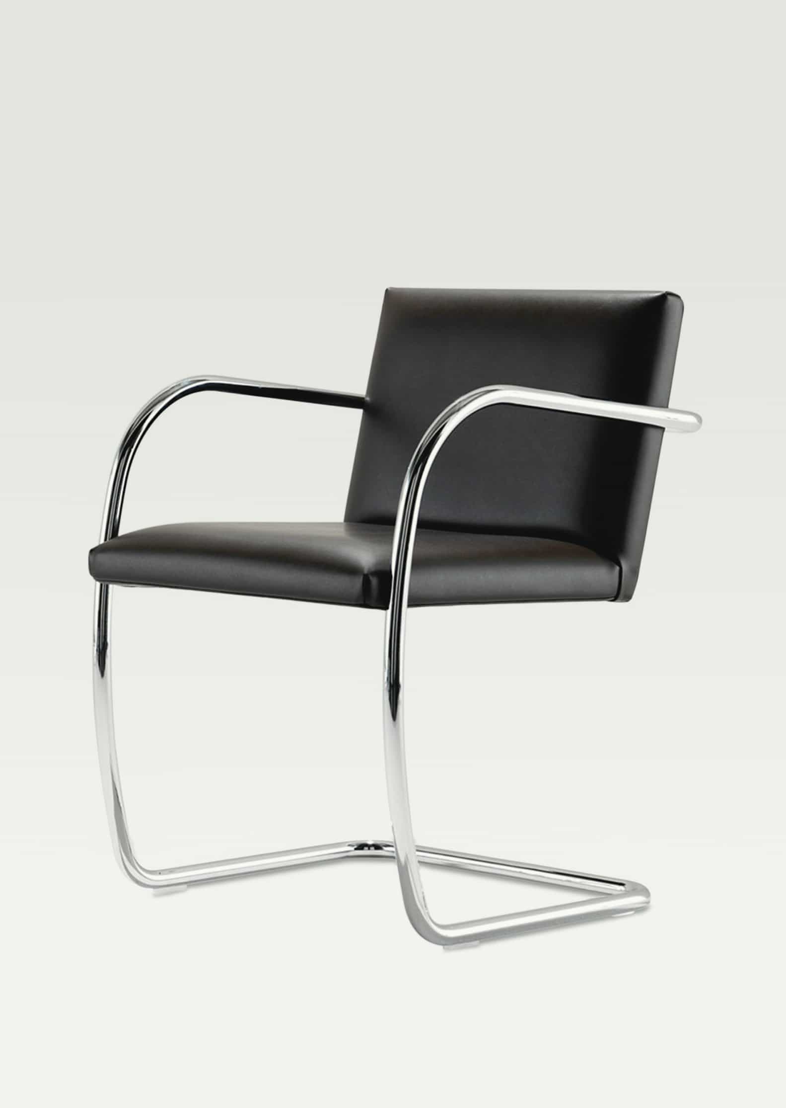 modern black leather and metal arm chair by Lilly Reich